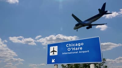 Plane landing in Chicago O'Hare with signboard Plane landing in Chicago O'Hare with signboard